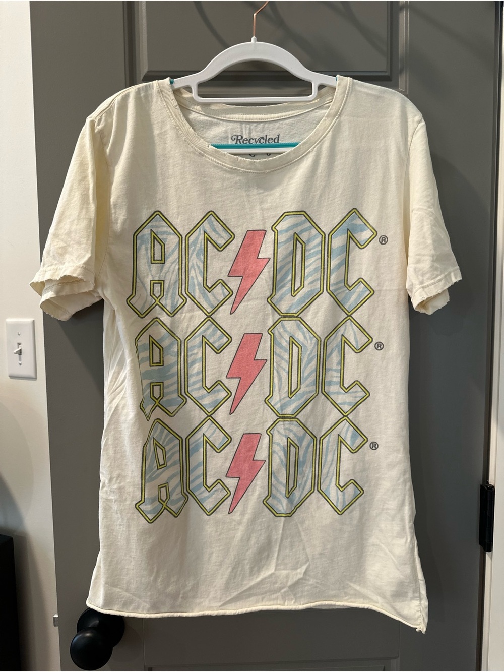 AC/DC Cream Tee with Pink Lightning and Blue Graphic
